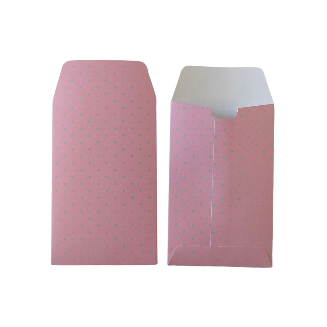 Two pink envelopes with a subtle pattern on a white background