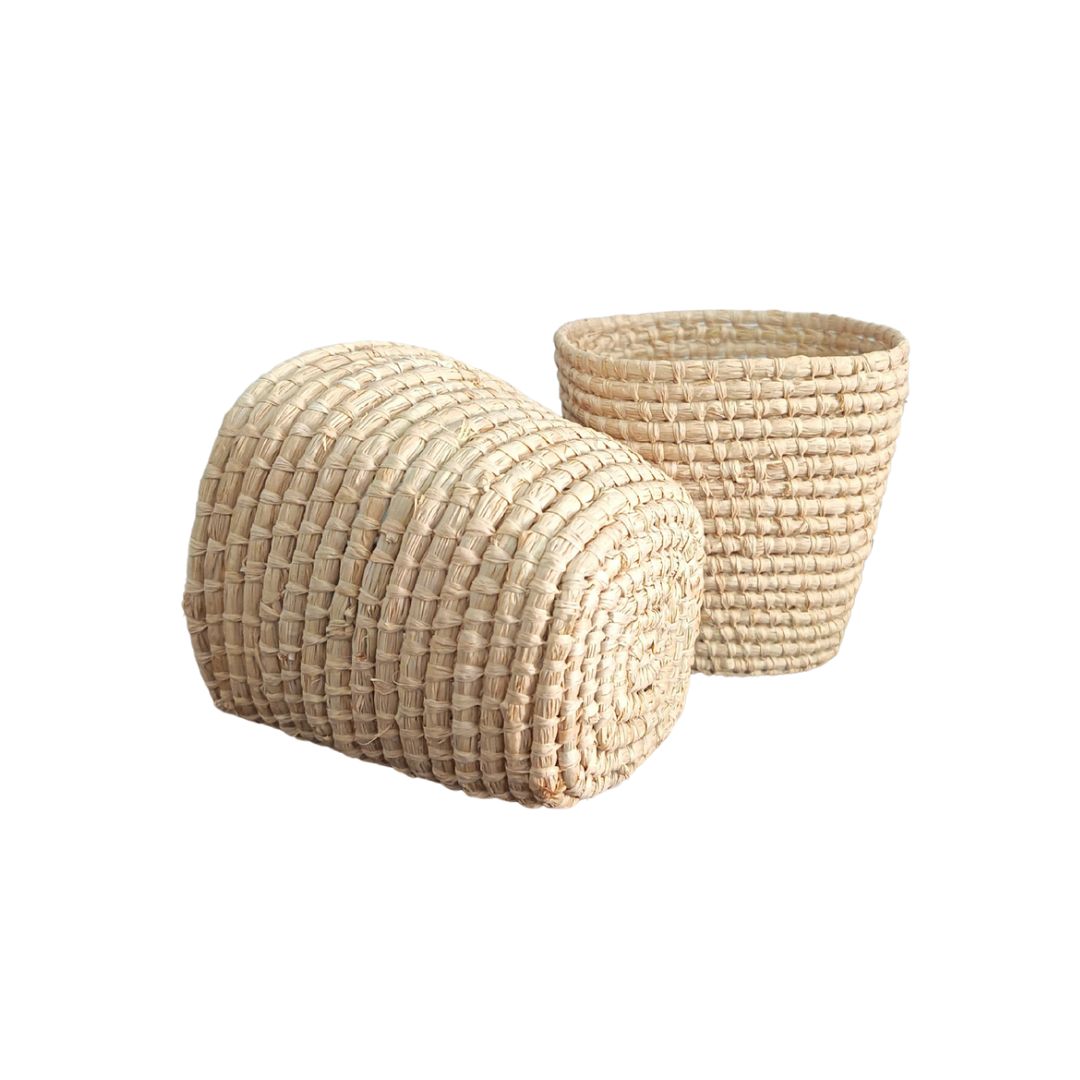 Two woven baskets on a white background