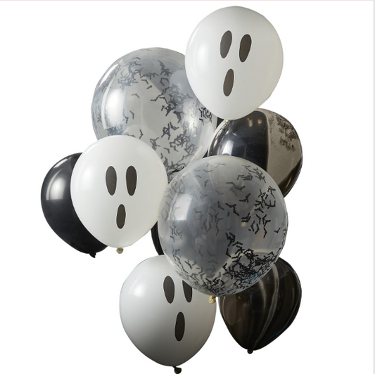 Halloween-themed balloons with ghost faces on a white background