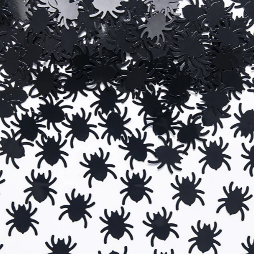 Black spider-shaped confetti on a white background