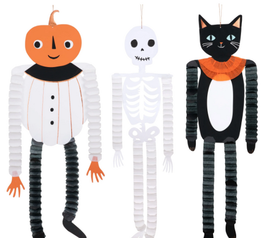 Three Halloween-themed decorations: a pumpkin, skeleton, and cat.