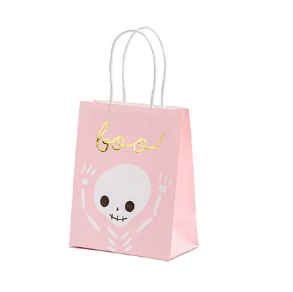 Pink Halloween-themed gift bag with skull design and 'boo!' text on a white background