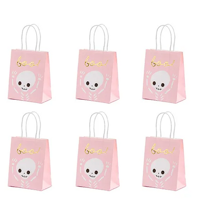 Set of six pink gift bags with skull designs and 'boo!' text on a white background