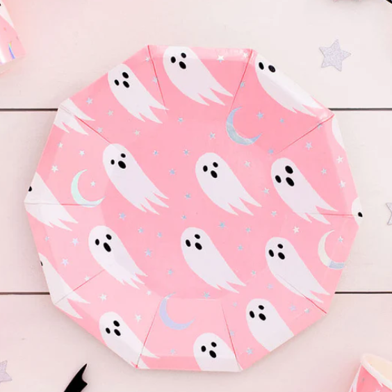 Pink paper plate with ghost pattern on a wooden surface