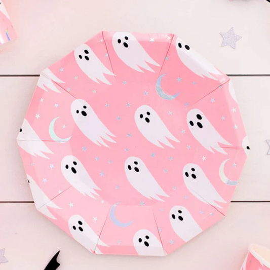 Pink paper plate with ghost pattern on a wooden surface