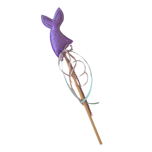 Purple mermaid tail on a wooden stick with a white background