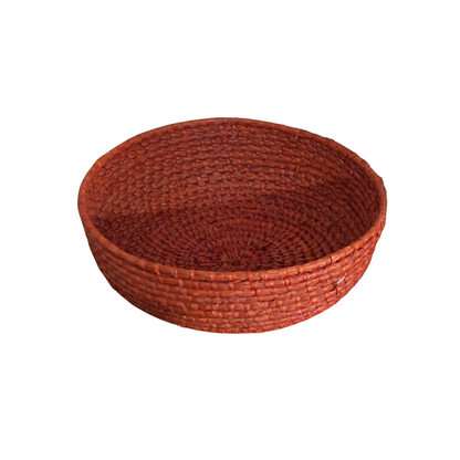 Round woven basket on a white background