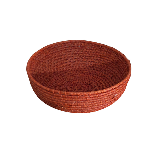 Round woven basket on a white background