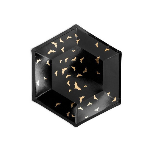 Black hexagonal plate with gold bat patterns on a white background