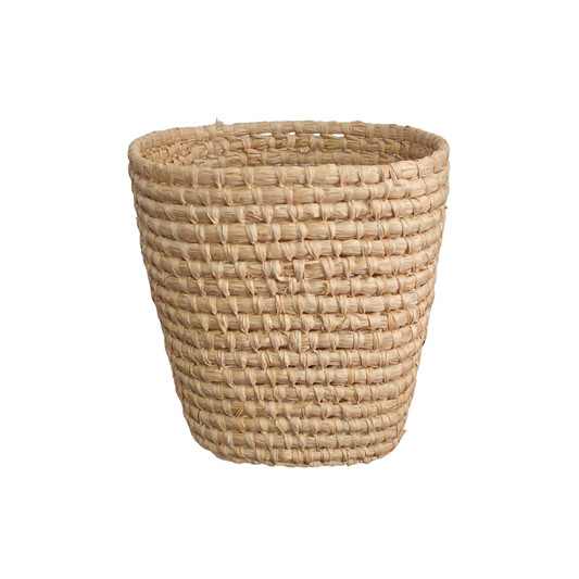 Woven basket made of natural materials on a white background