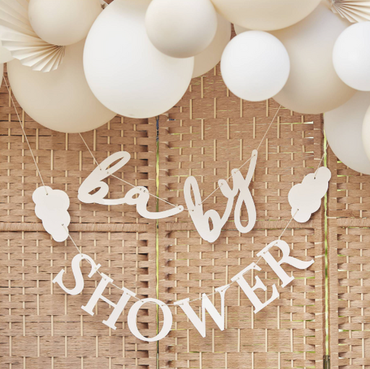 Baby shower banner with balloons on a woven background