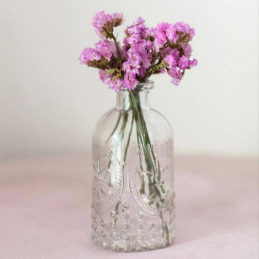 vintage-embossed-clear-glass-bottle